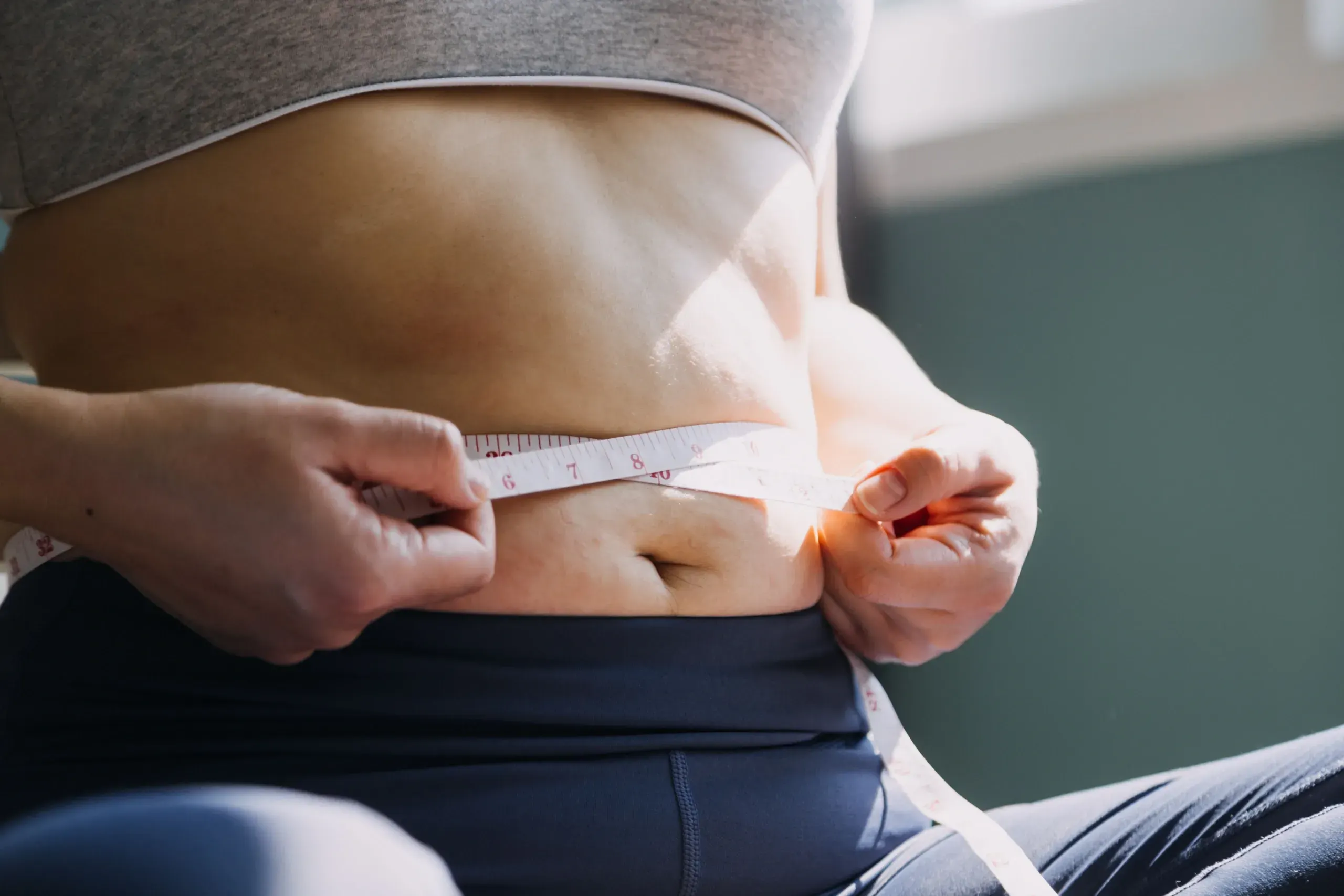 Patient consulting with physician about weight gain at WinMind Integrative Health Lutz